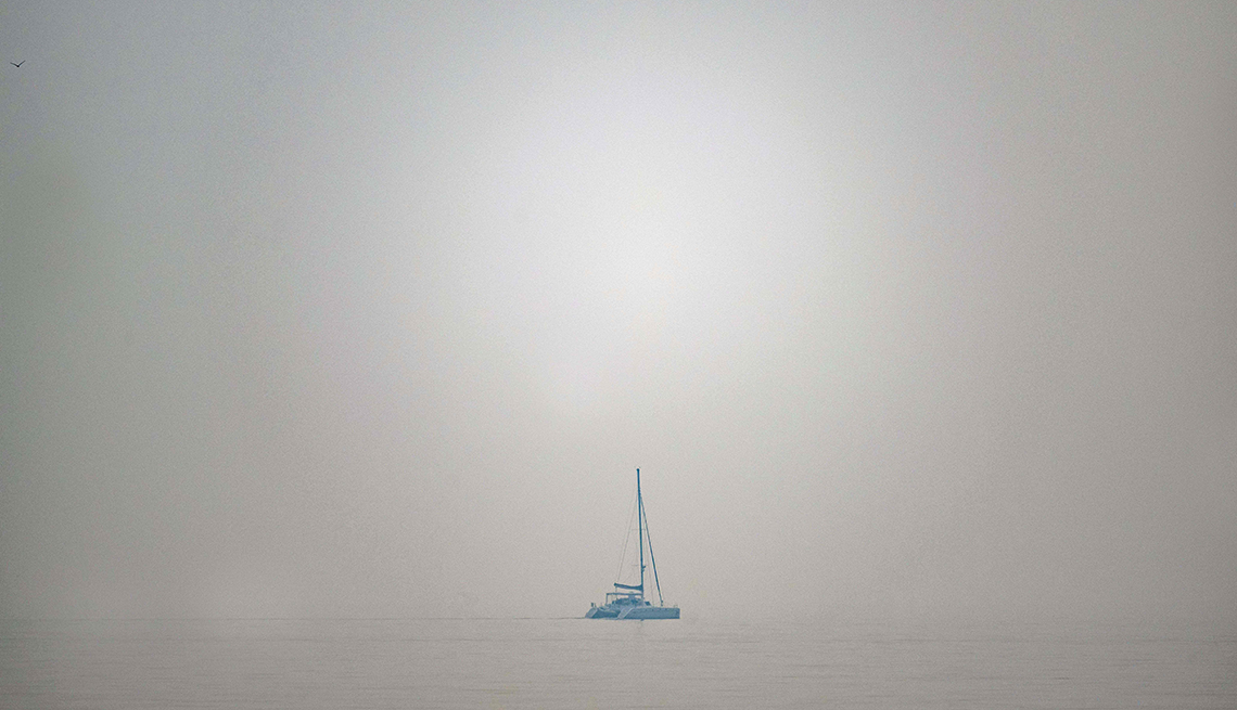 item 3 of Gallery image - A sailboat on the Chesapeake Bay travels through thick smoke from Canadian wildfires