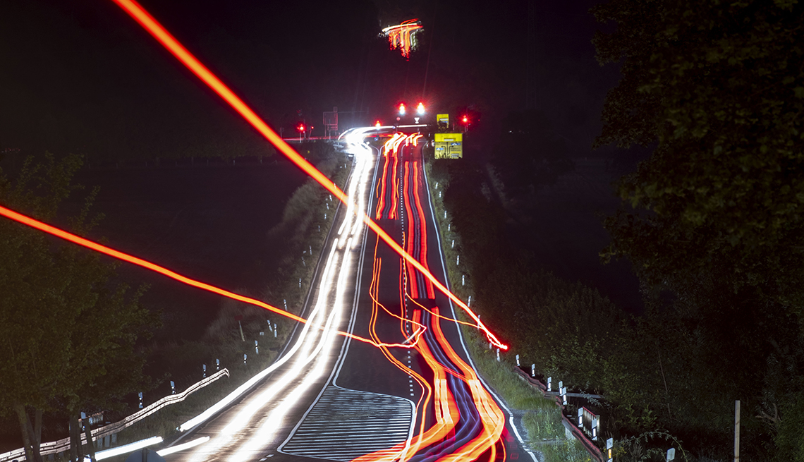 item 14 of Gallery image - A long exposure photo shows cars moving on a country road in Wehrheim near Frankfurt, Germany. 