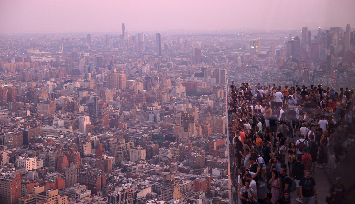 item 3 of Gallery image - People look over Manhattan from the Edge observation deck in New York City.