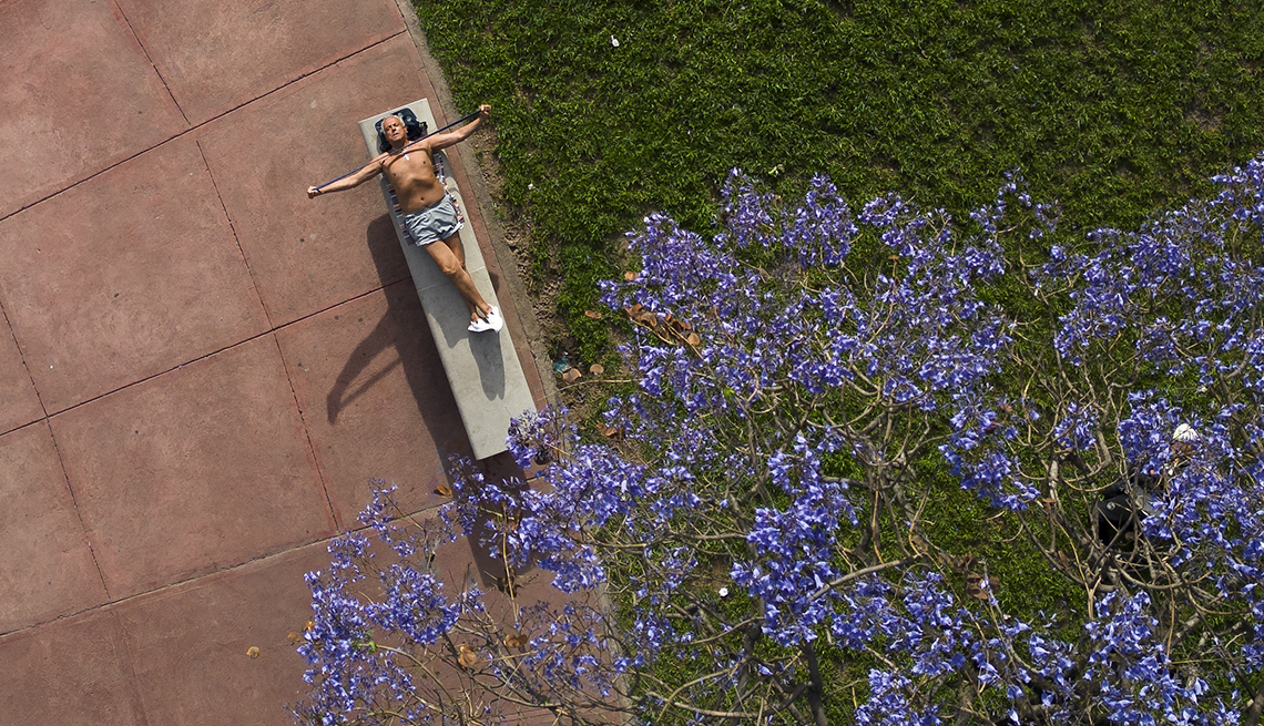 item 4 of Gallery image - A man sunbathes in downtown Buenos Aires, Argentina.
