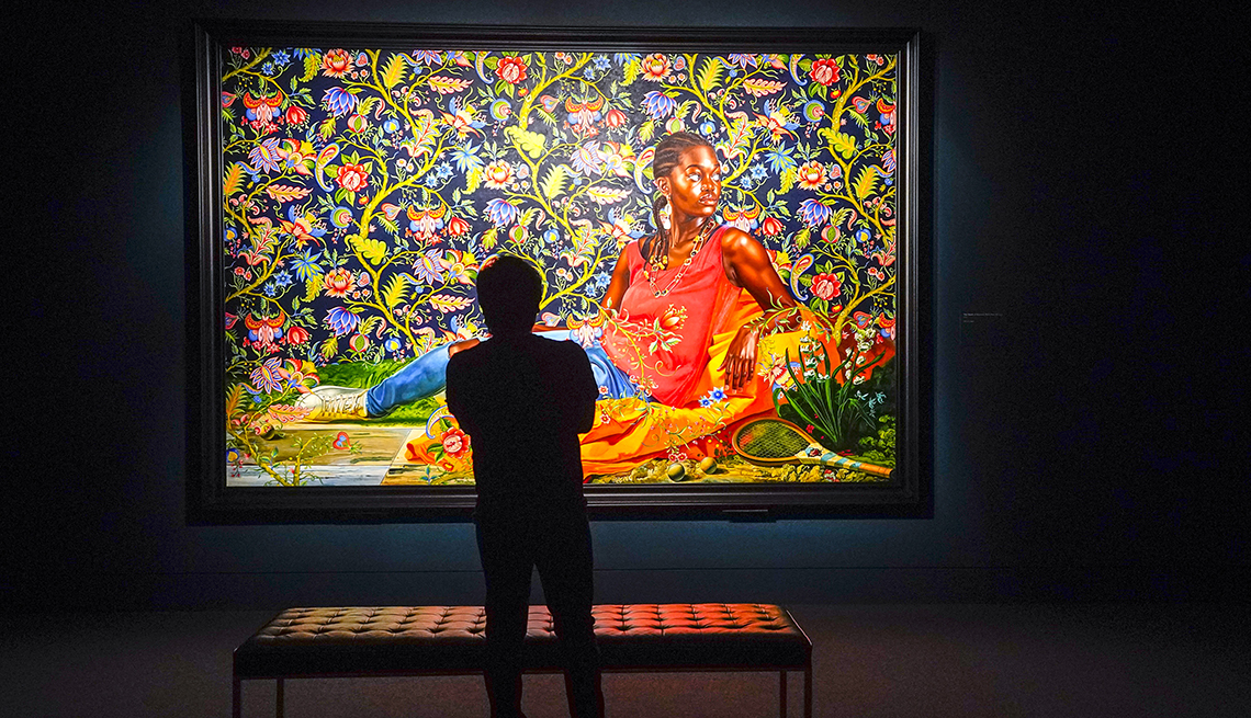 item 7 of Gallery image - A patron looks at Kehinde Wiley’s painting The Death of Hyacinth (Ndey Buri Mboup) ahead of the artist’s new show, “An Archeology of Silence,” at the Museum of Fine Arts in Houston. 