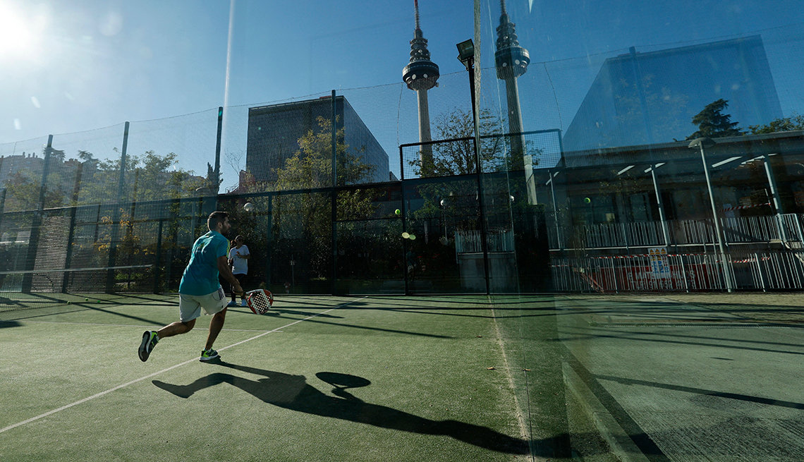 item 12 of Gallery image - People play padel tennis at an outdoor court in Madrid.  