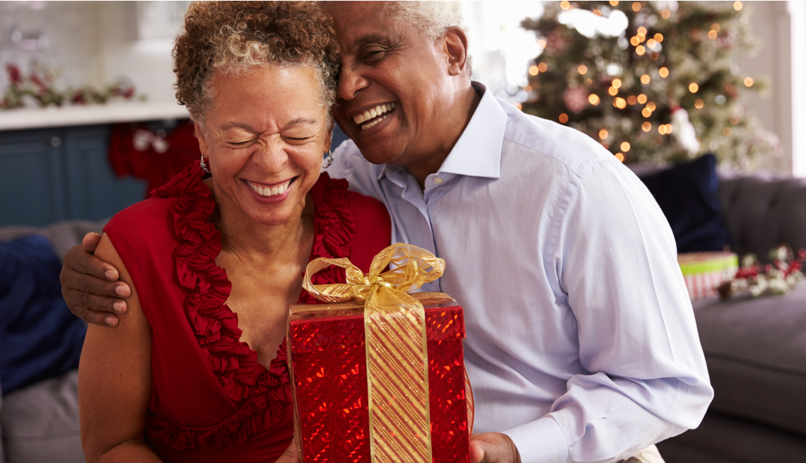 Image of a couple sharing a gift