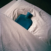 a hot water bottle in a bed