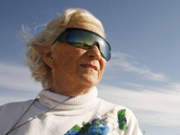 woman in wrap around sunglasses-block harmful ultraviolet rays
