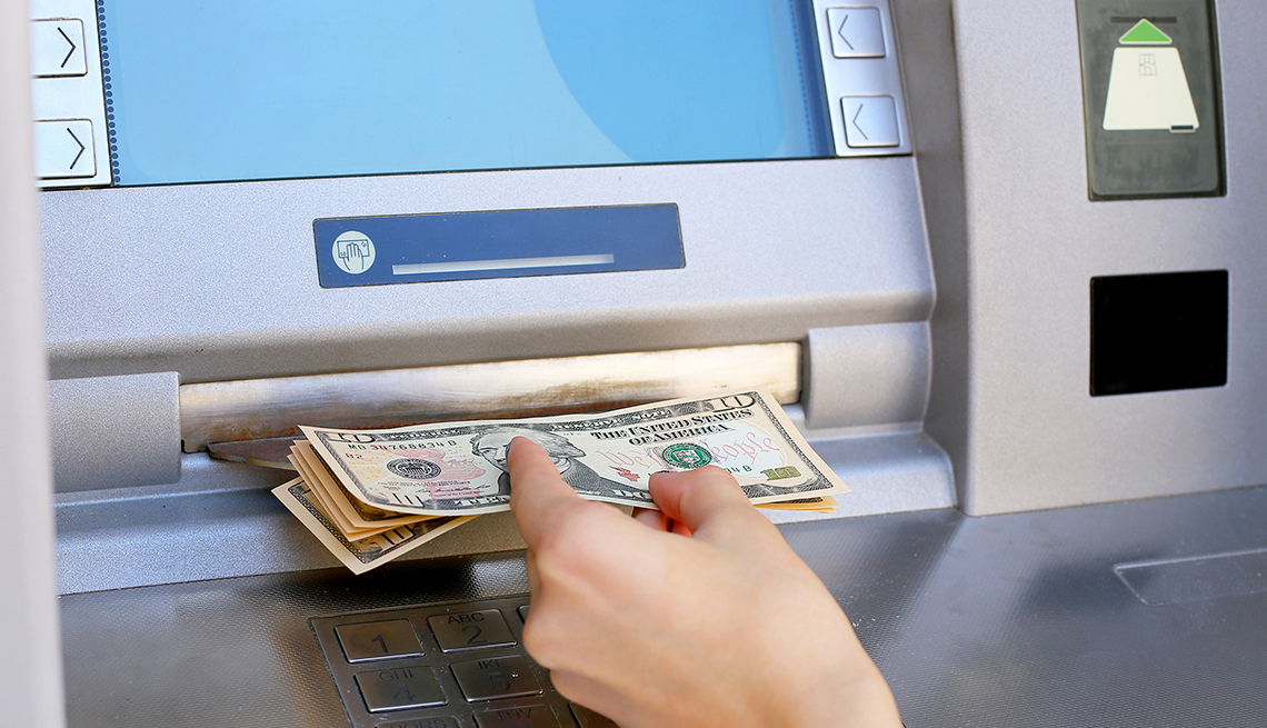 getting money from ATM machine,  Five Ways to Cut Nasty Banking Fees 