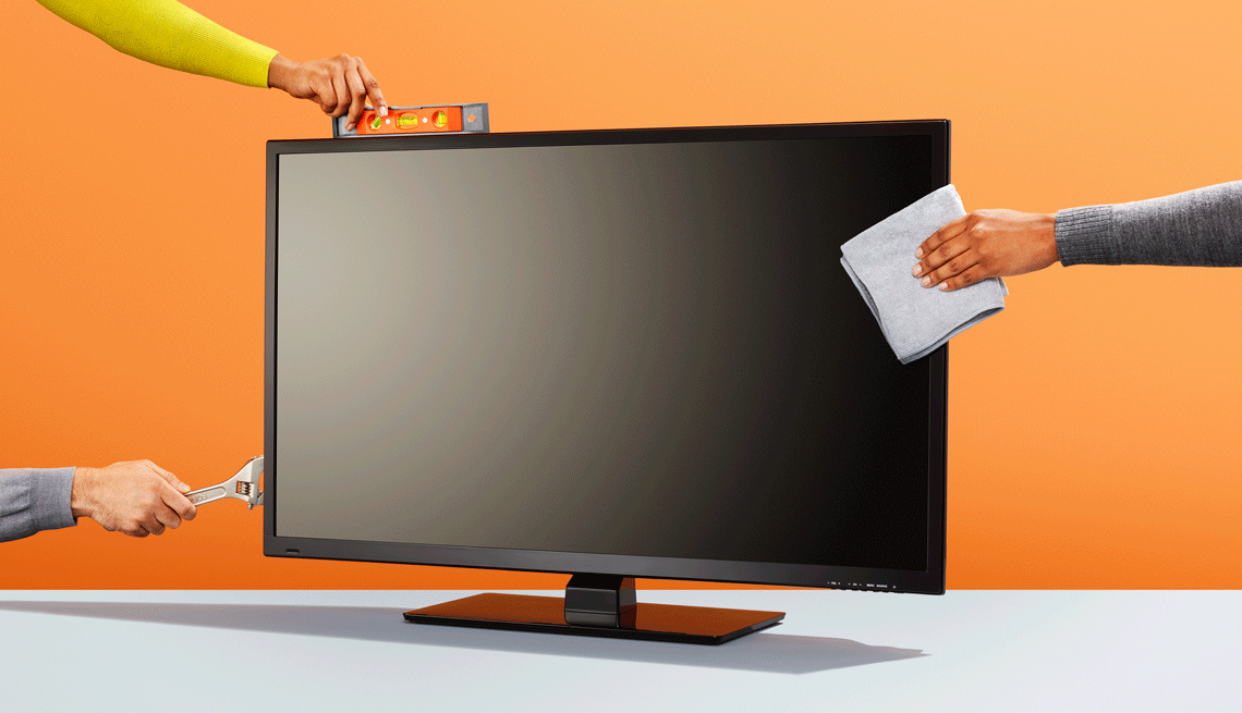 Imagen de un televisor con varios manos alrededor que sostienen herramientas y una libreta, como parte de las formas de ahorrar dinero