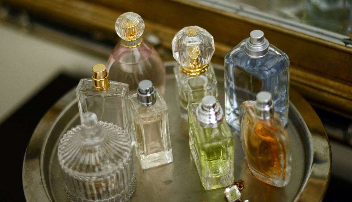 old used perfume bottles on a tray