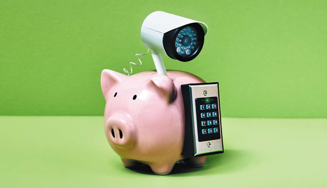 a piggy bank with a security camera and keypad attached to it