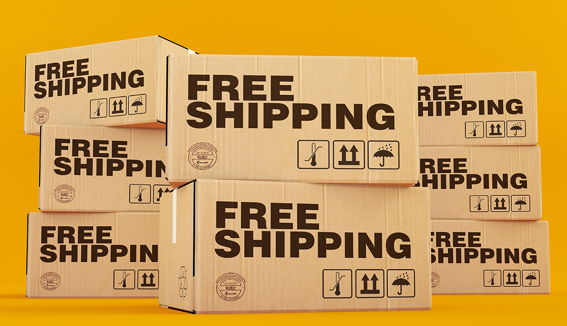 stacked cardboard boxes printed in bold print: FREE SHIPPING