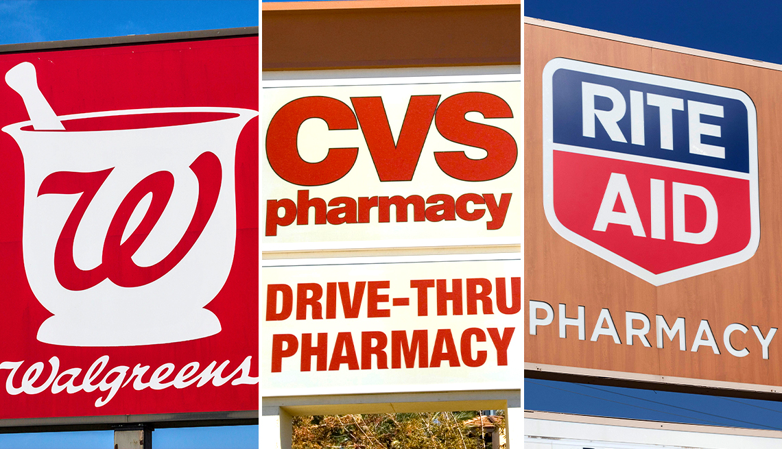 signs of three large drugstore chains walgreens c v s and rite aid