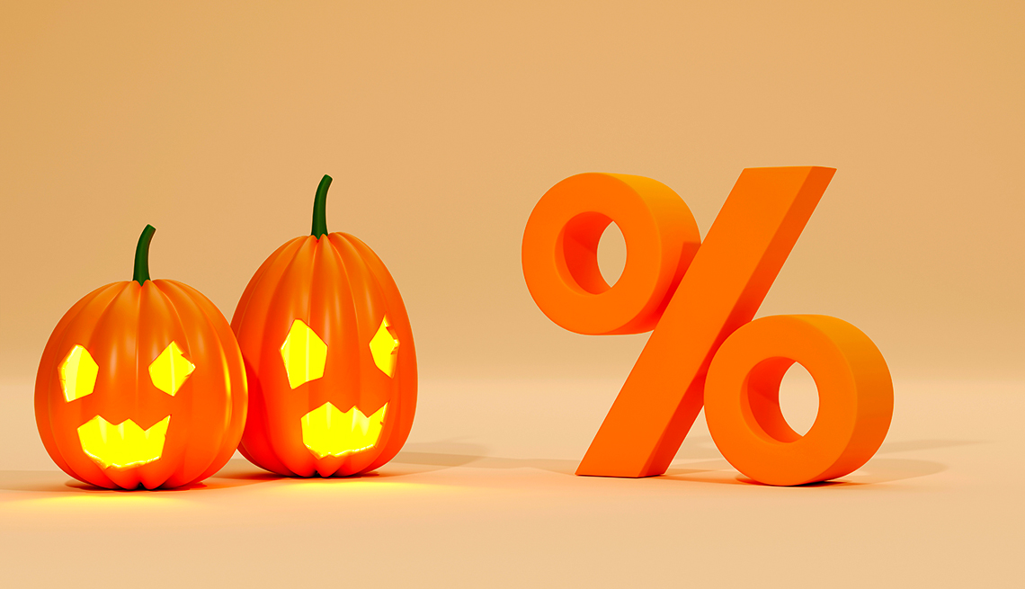 Ilustración de una calabaza decorada para Halloween al lado del símbolo de porcentaje