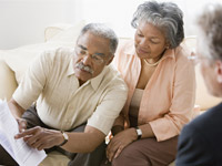 Couple with financial advisor-How to get the best financial advice AARP