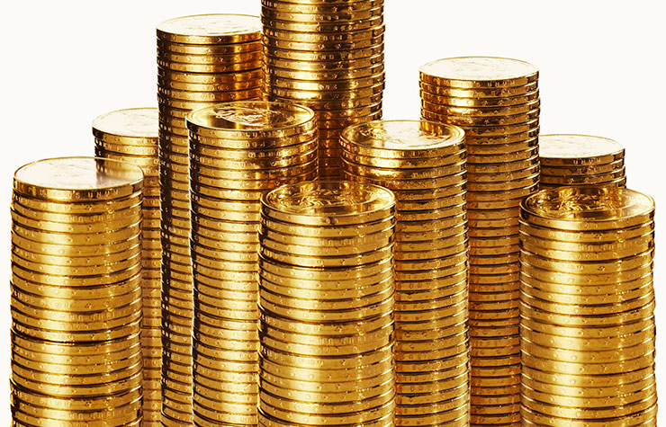 Monedas de oro apiladas - ¿Es buena idea comprar oro?