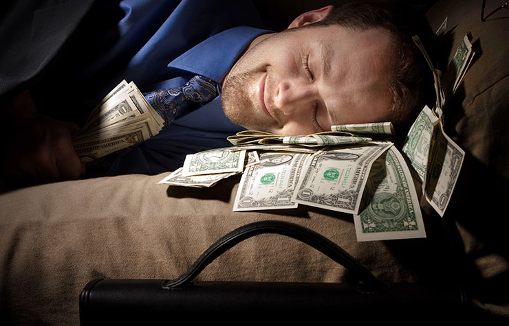 7 Deadliest Financial Sins, man sleeping with money 