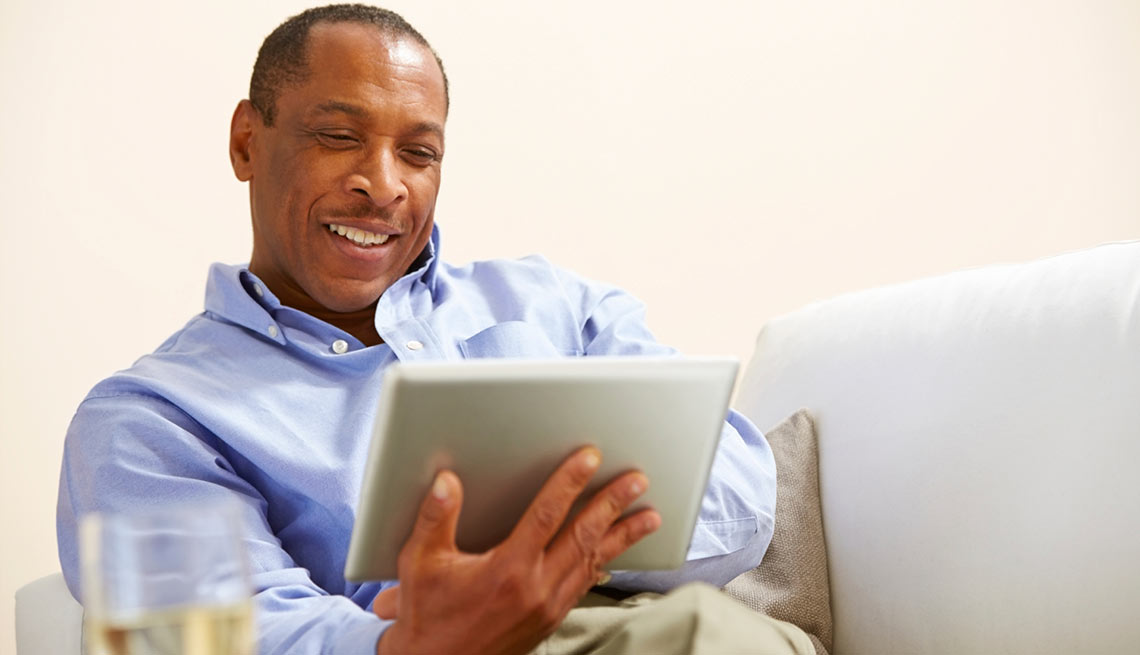 Man with a tablet, What’s Your Financial IQ: Quiz