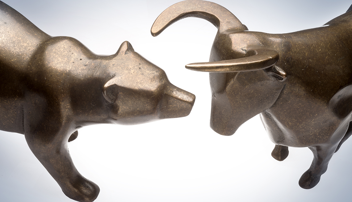 brass sculptures of bull and bear