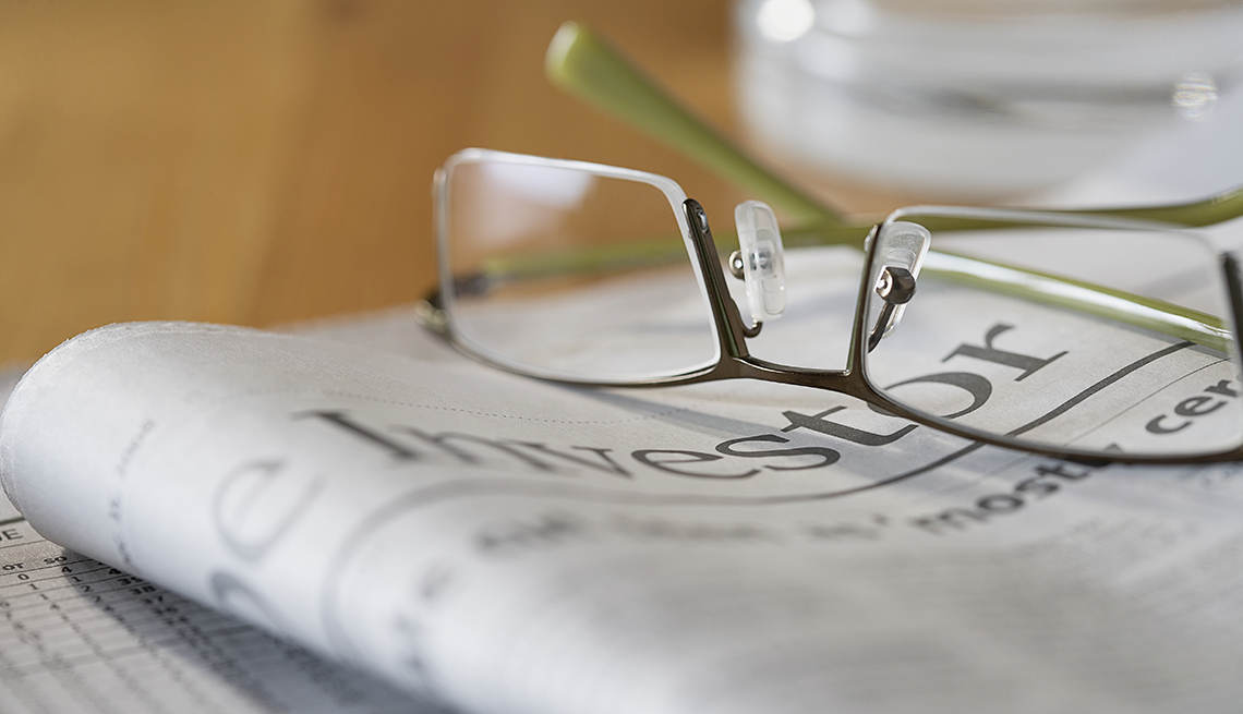 Eyeglasses on financial newspaper 