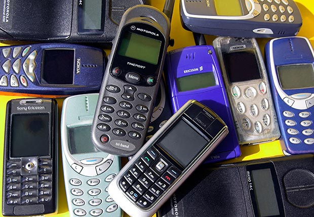 Collection of old cell phones. 10 spending regrets.