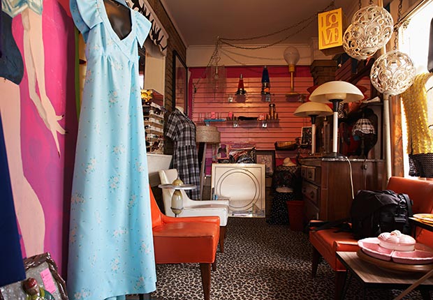 Clothing and Furniture in Crowded Second Hand Store. (Moodboard/Alamy)