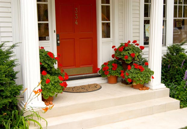 Give your front door a fresh coat of paint. $100 or less DIY home fixes. (Chuck Eckert/Alamy)
