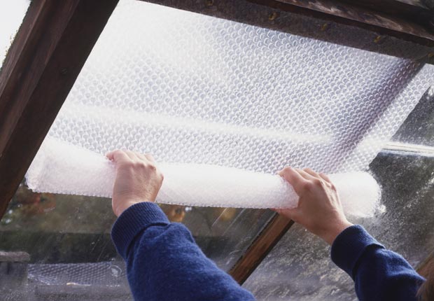 Insulate basement windows with bubble wrap. (Dorling Kindersley/Getty Images)