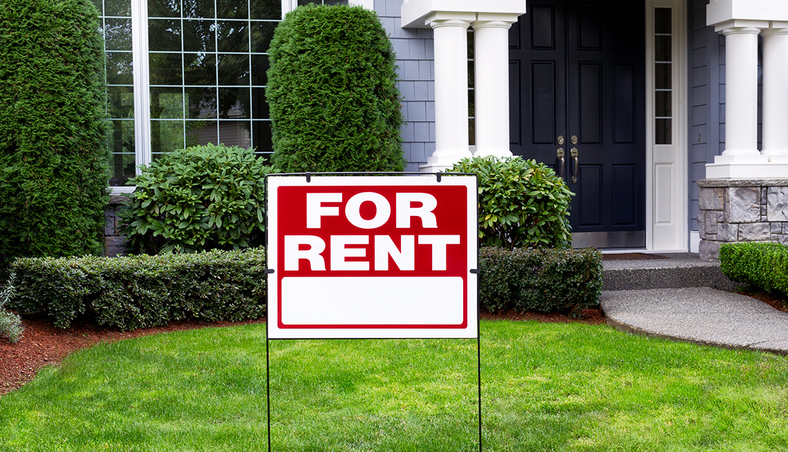 For rent sign in front of house