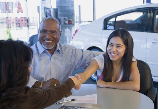 Father and daughter buying car, Car loans are bad to co-sign