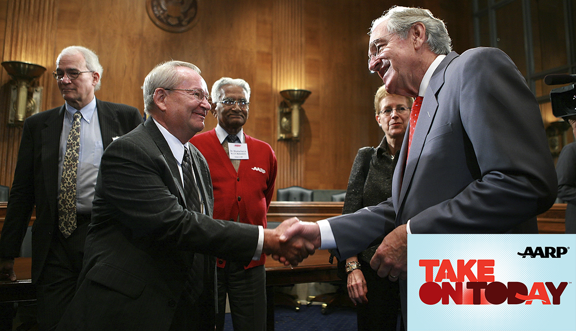 Senator Tom Harkin, right, shakes hands with Jack Gross