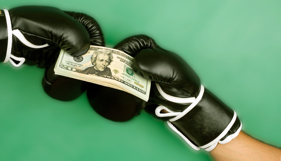 money and boxing gloves 