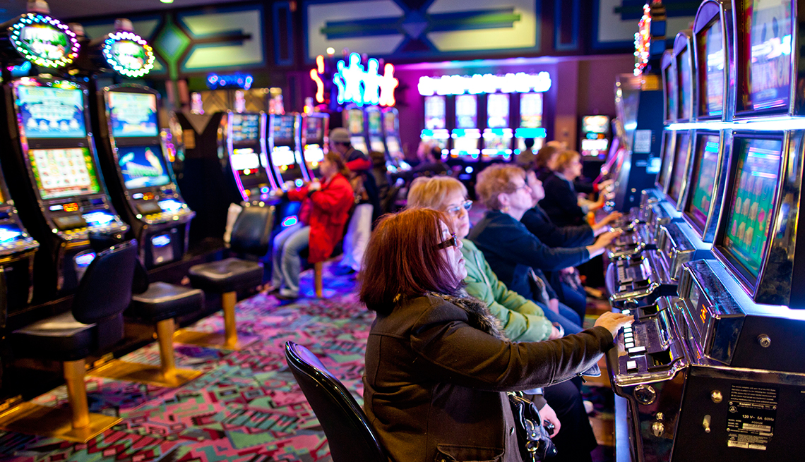 Gamblers play on a casino floor 