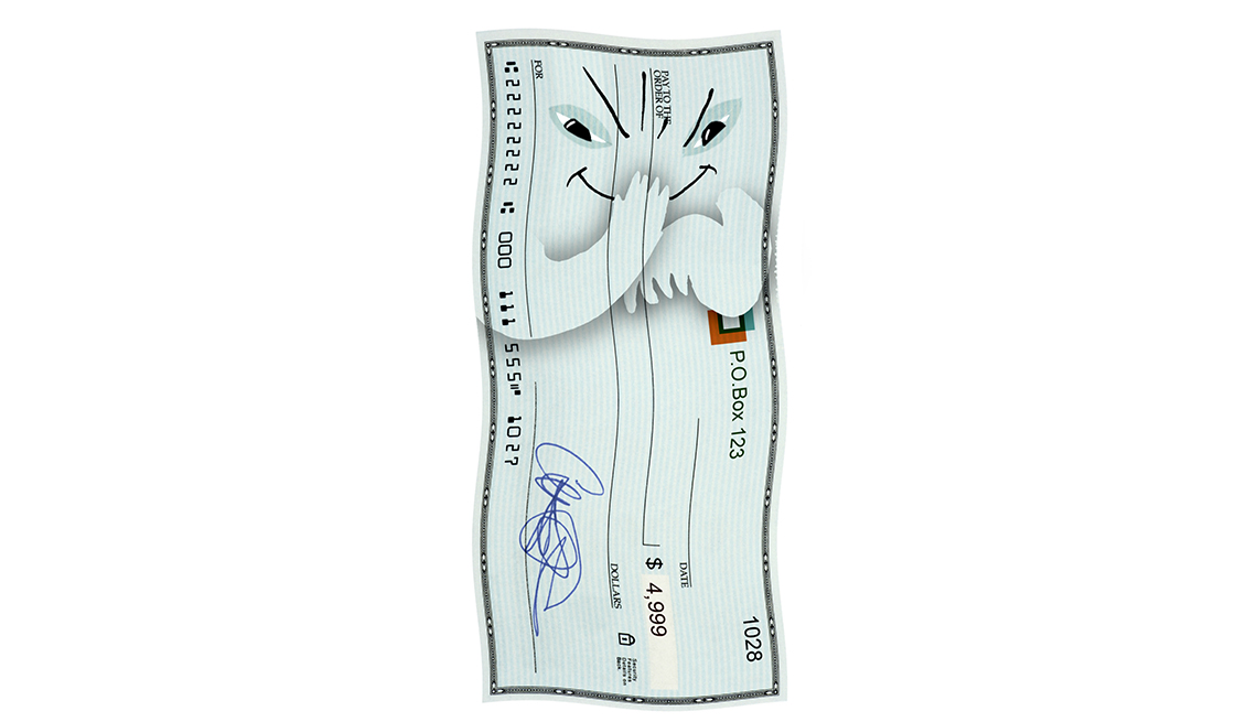 Imagen de un cheque con una cara de maldad, y cuidado con los cheques falsos.