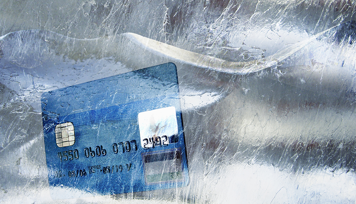 Credit card in frozen block of ice