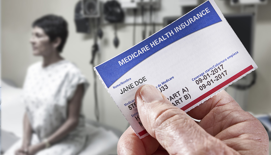 Medicare Health Insurance Card in medical office with patient in background