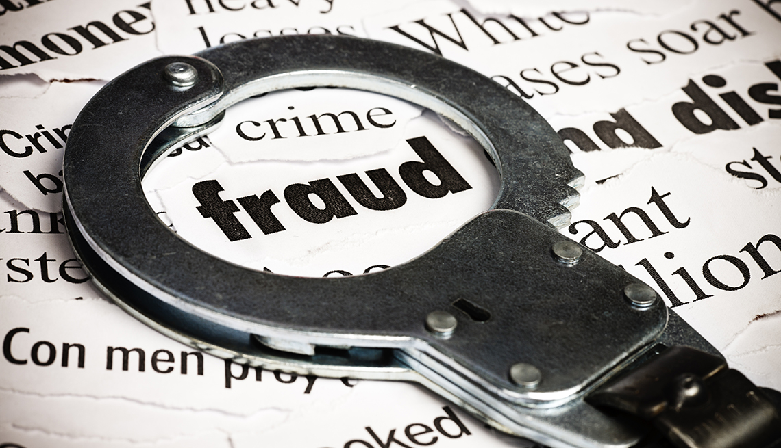 a handcuff circles the word fraud in the middle of a pile of associated words