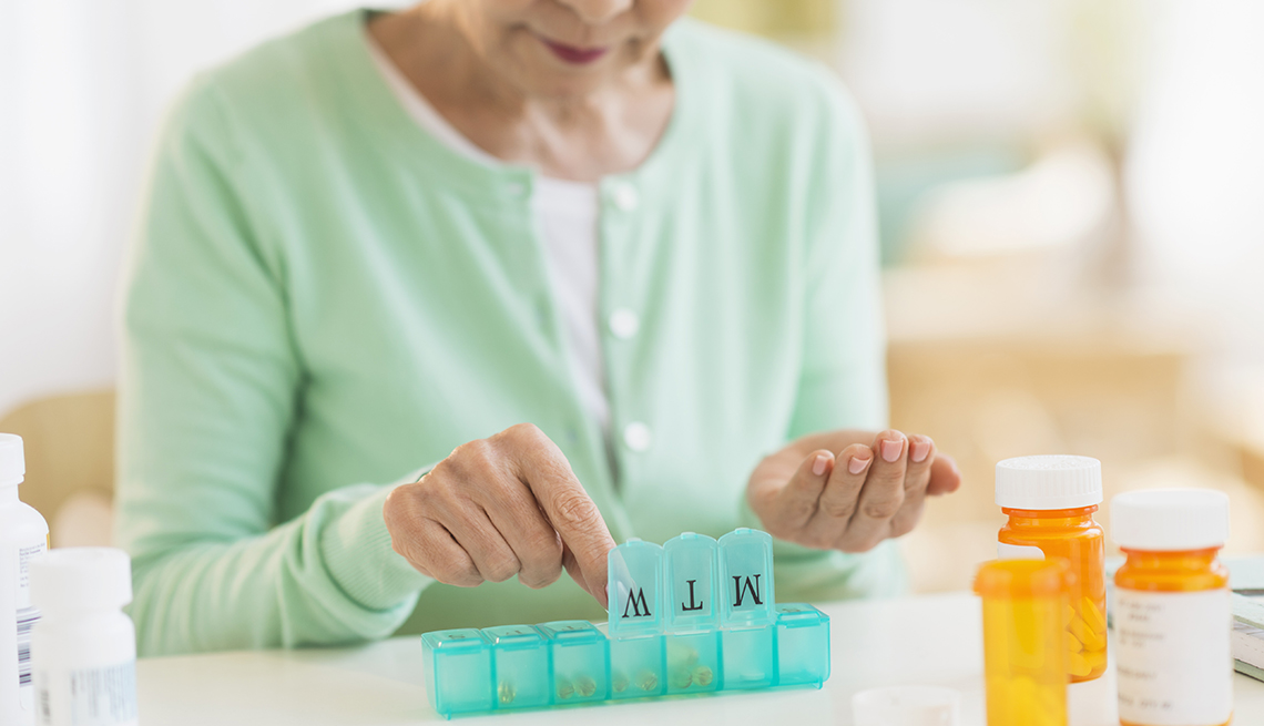Woman sorting her pills