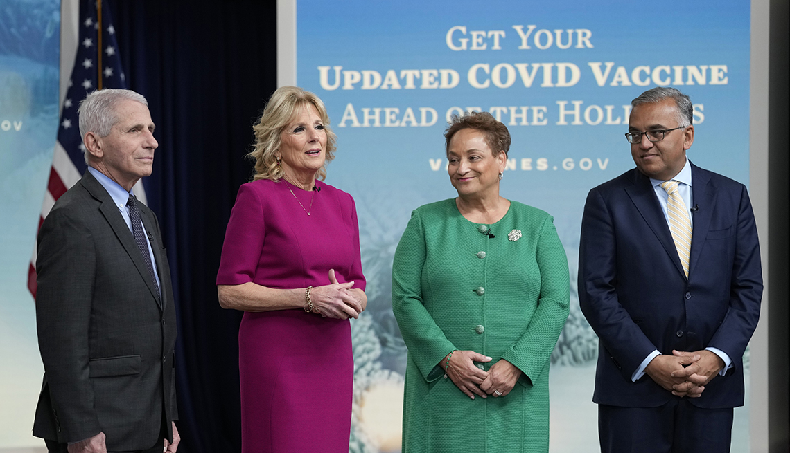 First lady Jill Biden, second from left, speaks during the opening remarks of a virtual White House town hall in the South Court Auditorium on the White House complex in Washington, Friday, Dec. 9, 2022, on getting an updated COVID-19 vaccine this holiday season, especially for Americans ages 50 and older. She is joined by, from left, Dr. Anthony Fauci, the top U.S. infectious disease expert, AARP CEO Jo Ann Jenkins, and White House COVID-19 Response Coordinator Ashish Jha.