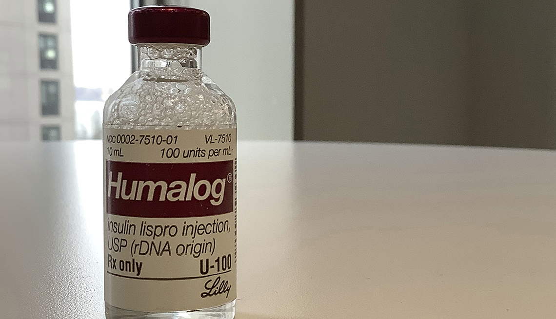 a vial of humalog sits on a table