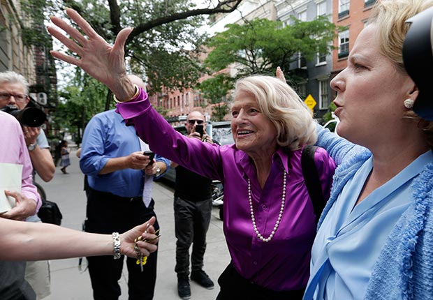 Edith Windsor, left, the plaintiff in the historic gay marriage case before the U.S. Supreme Court, accompanied by her attorney Robert Kaplan, arrives at the LGBT Center for a news conference, in New York, Wednesday, June 26, 2013. (AP)