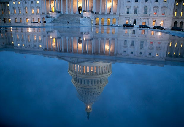 The U.S. Capitol is seen reflected in Washington, D.C. (Bloomberg/Getty Images)