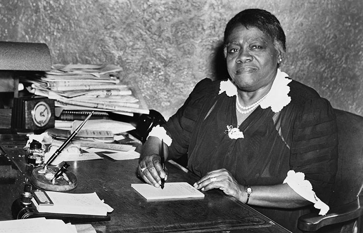 Educator Mary McLeod Bethune sits at a desk, possibly in the Chicago Defender offices in 1942, Historical Review of Leading Black Civil Rights Organizations