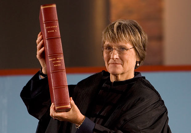 Drew Gilpin Faust holds the ceremonial college book, during her swearing-in as Harvard University's first woman president in Cambridge, Massachusetts