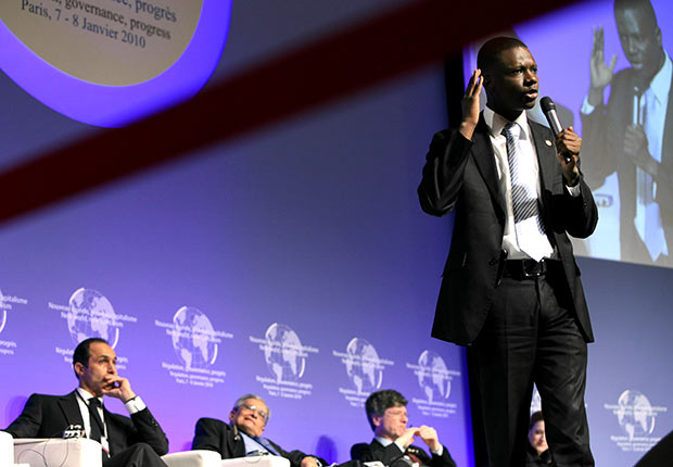 Chairman of the Young Democrats of America, Thione Niang speaks during the symposium 'New World New Capitalism' in Paris, France.