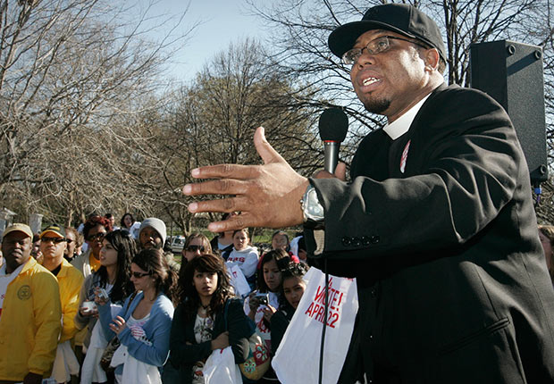 Rev. Lennox Yearwood, Jr., addresses survivors of Hurricane Katrina and their supporters as they demonstrate outside the White House after a march that started on Capitol Hill in Washington.