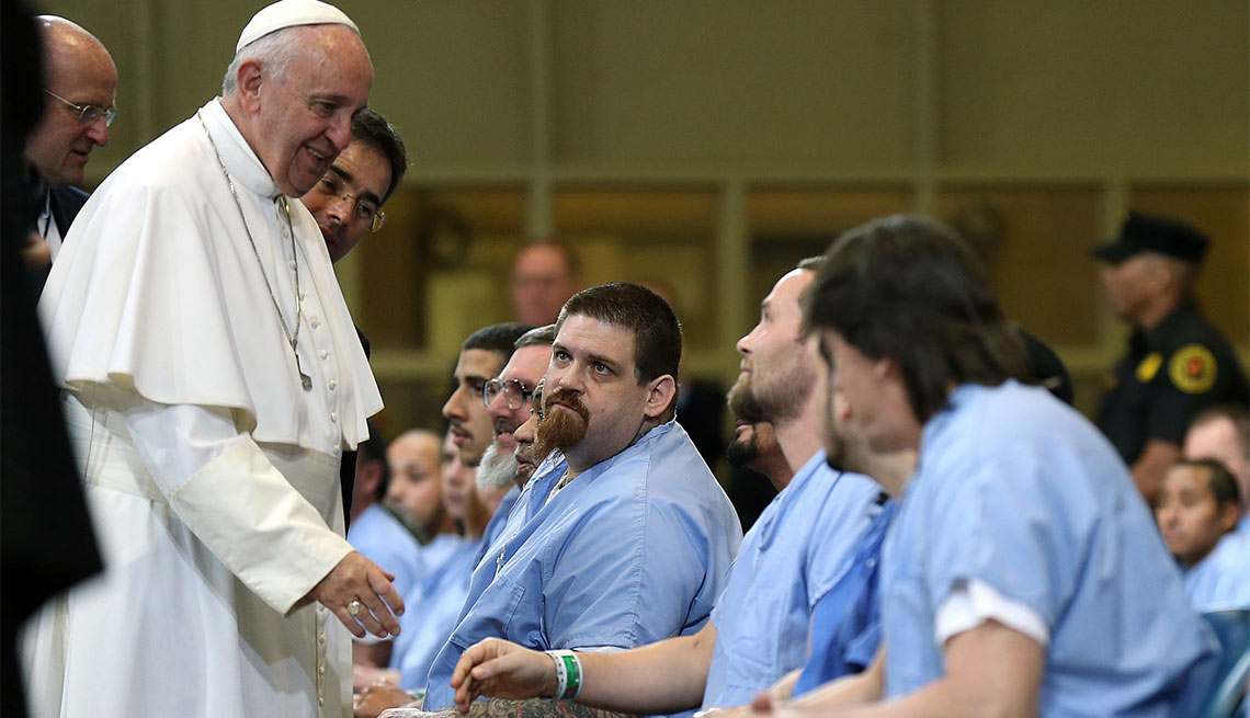 Pope Francis greets inmates during his visit to Curran Fromhold Correctional Facility in Philadelphia, Sunday, Sept. 27, 2015.