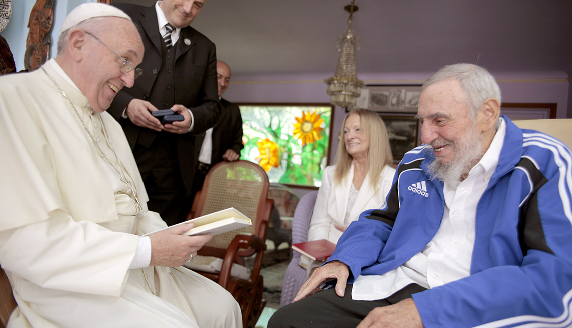 Pope Francis meets Cuba's Fidel Castro, as Castro's wife Dalia Soto del Valle looks on, in Havana, Cuba, Sunday, Sept. 20, 2015. The Vatican described the 40-minute meeting at Castro's residence as informal and familial, with an exchange of books. 