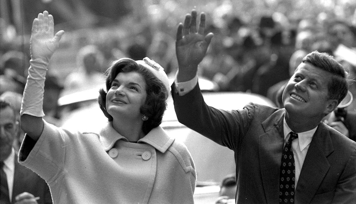 ohn and Jacqueline Kennedy (pregnant with their son, John Jr.) wave to supporters in Manhattan. 