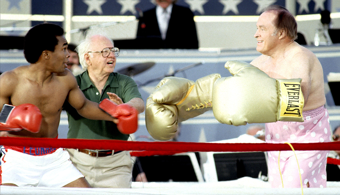 Sugar Ray Leonard, Mickey Rooney, and Bob Hope during Taping of Bob Hope USO 40th Anniversary Show at West Point in West Point, New York, United States.