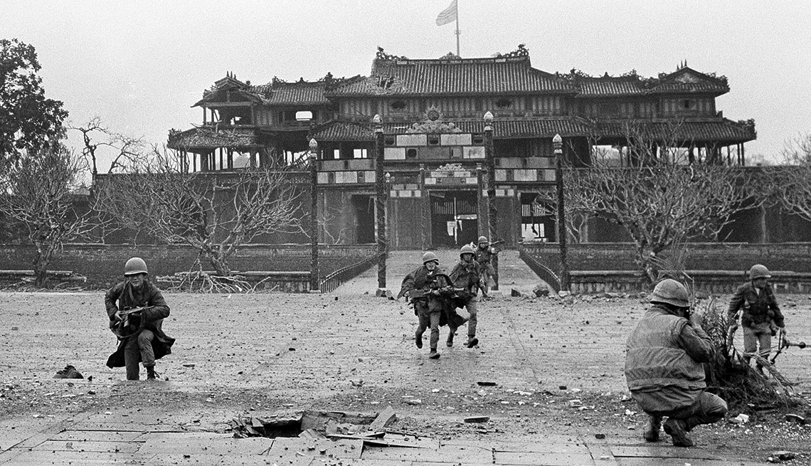 item 7 of Gallery image - U.S. Marines and Vietnamese troops move through the grounds of the Imperial Palace in the old citadel area of Hue, Vietnam 