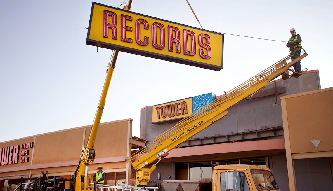item 5 of Gallery image - Tower records sign being removed from a store 
